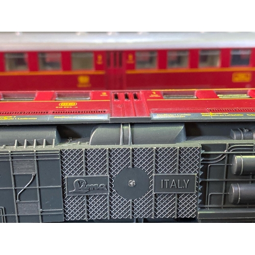 168 - H0 Gauge models. Two Lima diesel engines (red), two Lima carriages, two Liliput boxed goods wagons a... 