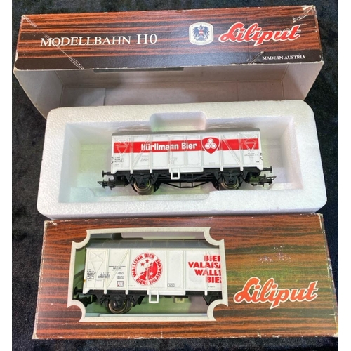 168 - H0 Gauge models. Two Lima diesel engines (red), two Lima carriages, two Liliput boxed goods wagons a... 