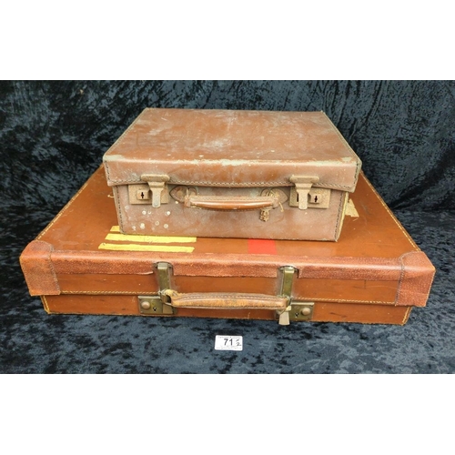 71 - Two vintage brown leather suitcases - largest by Revelation with remains of address labels to top, a... 