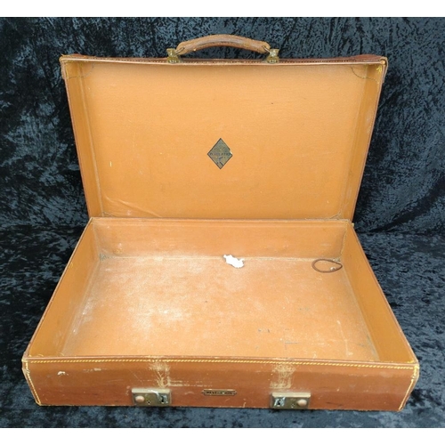 71 - Two vintage brown leather suitcases - largest by Revelation with remains of address labels to top, a... 