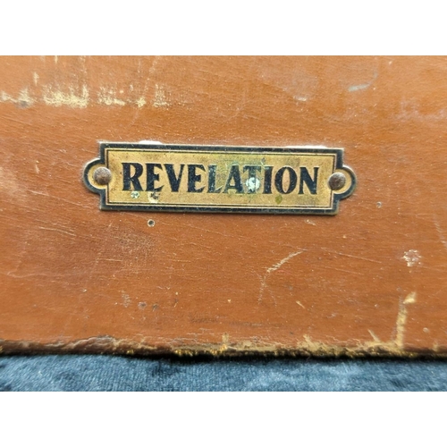 71 - Two vintage brown leather suitcases - largest by Revelation with remains of address labels to top, a... 