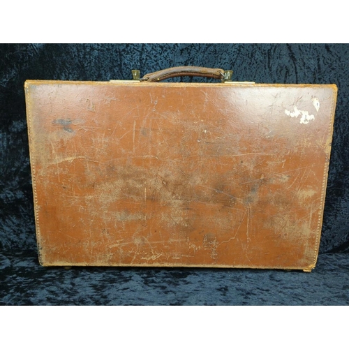 71 - Two vintage brown leather suitcases - largest by Revelation with remains of address labels to top, a... 