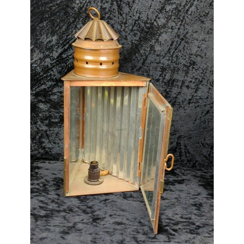 72 - Two antique copper and glass triangular signal lanterns, one converted historically to electric, plu... 