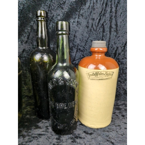 74 - Collection of vintage green glass bottles, stoneware flagons and bottles, plus an antique salt-glaze... 