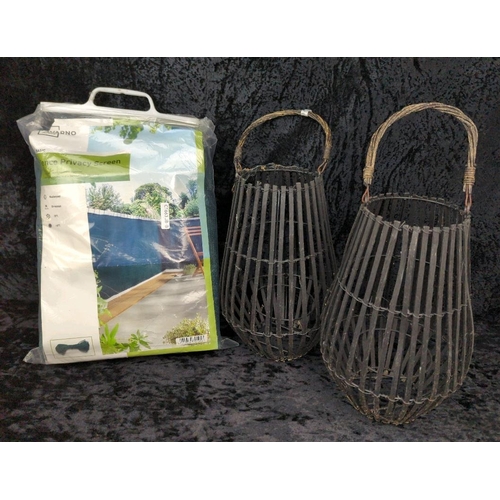 77 - Vintage wicker shopping basket, two rattan lanterns, and an unused fence privacy screen.