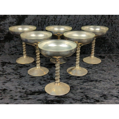 80 - Large collection of silver plate including teapots, and six coupes with plastic liners.