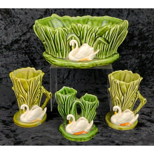 21 - Collection of four vintage SylvaC swan vases and a planter. Largest approx H9 x W19cm.