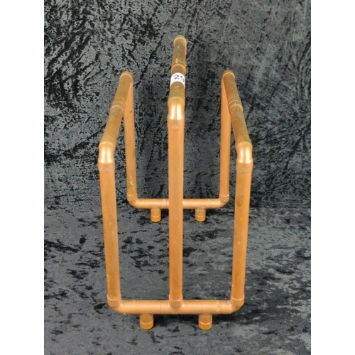 29 - Steampunk style magazine rack made from copper pipes. Approx H30 x W25cm.