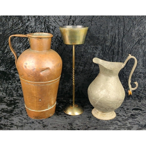 30 - Antique copper jug, with a pewter jug (handle needs fixing) and a heavy brass candlestick. Tallest a... 