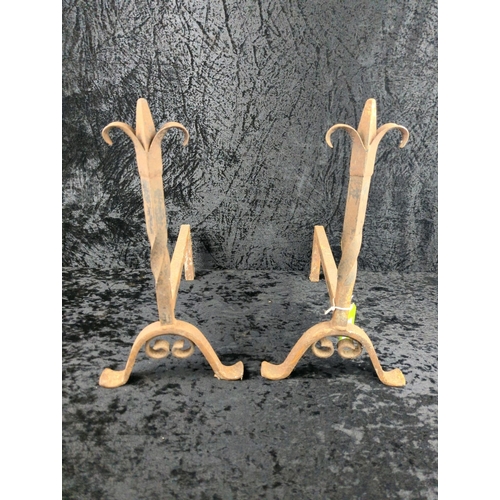 31 - Pair of antique rusted steel fireside dogs. Each approx H44 x D37cm.
