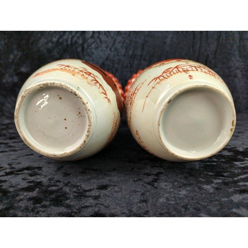 39 - Pair of antique Japanese Satsuma trumpet vases, with hand-painted red, black and gold detailing and ... 