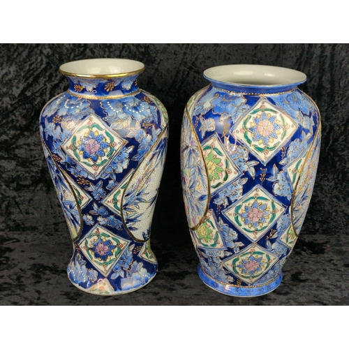 41 - Two large vintage ceramic vases with blue patterns and bamboo plants and gilt detailing. Marked Made... 