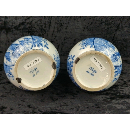 48 - Pair of old blue and white Delft ceramic vases. Each approx H25cm.