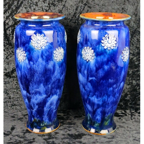 49 - Pair of early 20th century Royal Doulton vases with deep blue glaze and white relief flowers. Each a... 