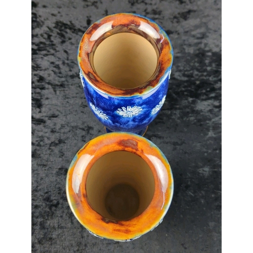 49 - Pair of early 20th century Royal Doulton vases with deep blue glaze and white relief flowers. Each a... 