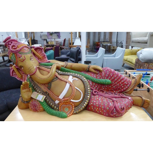 122 - GANESH IN RECUMBENT POSE, polychrome finish, 150cm x 75cm H.