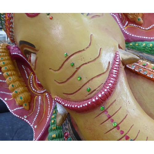 122 - GANESH IN RECUMBENT POSE, polychrome finish, 150cm x 75cm H.