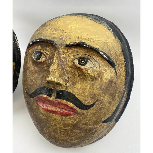 404 - INDIAN WALL MASKS, two, vintage hand painted papier-mâché, largest 43cm x 36cm. (2) (with faults)