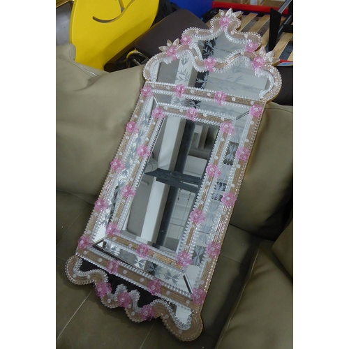 64 - WALL MIRROR, Venetian style design, with pink floral detail, 117cm x 55cm.