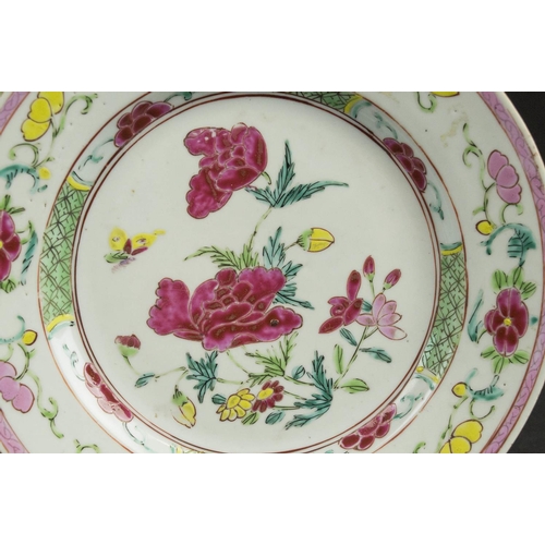 691 - CHINESE FAMILLE ROSE PORCELAIN PLATES, a pair, Qianlong, decorated with a spray of peony flowers to ... 