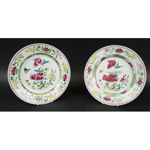 691 - CHINESE FAMILLE ROSE PORCELAIN PLATES, a pair, Qianlong, decorated with a spray of peony flowers to ... 