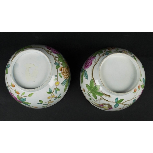 693 - BOWLS, a pair, 18th/19th century cream ware, possibly Spode, decorated with perched bird and bright ... 