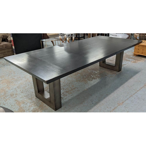 20 - DINING TABLE, contemporary ebonised top, on steel pedestals, 275cm x 130cm x 78cm. (with faults)