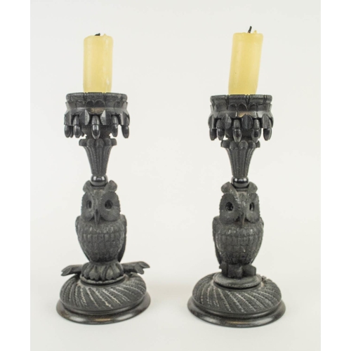 597 - BLACK FOREST STYLE CARVED WOOD CANDLESTICKS, a pair, 20cm H. (2) (slight faults)