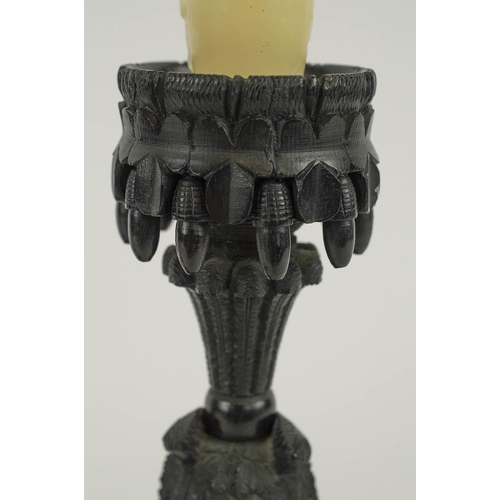 597 - BLACK FOREST STYLE CARVED WOOD CANDLESTICKS, a pair, 20cm H. (2) (slight faults)