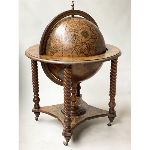 100 - GLOBE COCKTAIL CABINET, in the form of an antique terrestrial globe on stand with rising lid and fit... 