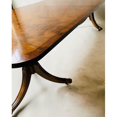 603 - EXTENDING DINING TABLE, George III design, yew wood raised upon twin pillar outswept supports with t... 