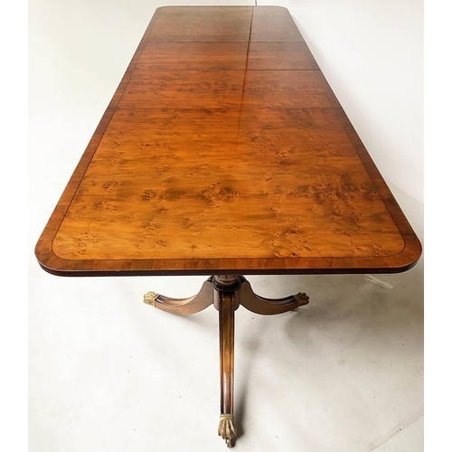 603 - EXTENDING DINING TABLE, George III design, yew wood raised upon twin pillar outswept supports with t... 