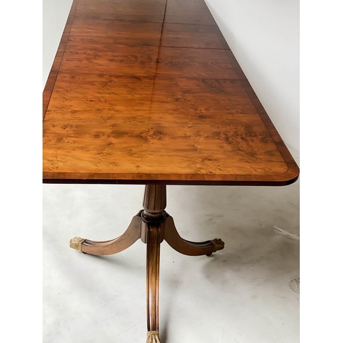 603 - EXTENDING DINING TABLE, George III design, yew wood raised upon twin pillar outswept supports with t... 