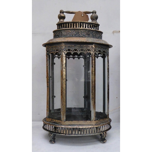 48 - STORM LANTERNS, a set of three, antiqued gilt finish, 158cm H. (3)