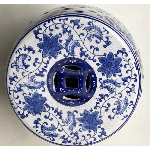 572 - CHINESE GARDEN STOOLS, a pair, blue and white ceramic, barrel shaped and pierced, 46cm H. (2)