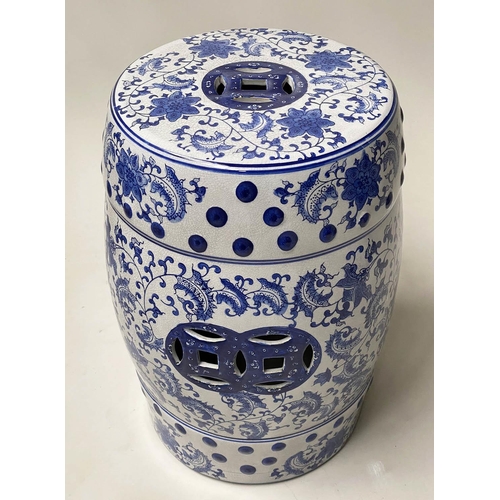 572 - CHINESE GARDEN STOOLS, a pair, blue and white ceramic, barrel shaped and pierced, 46cm H. (2)