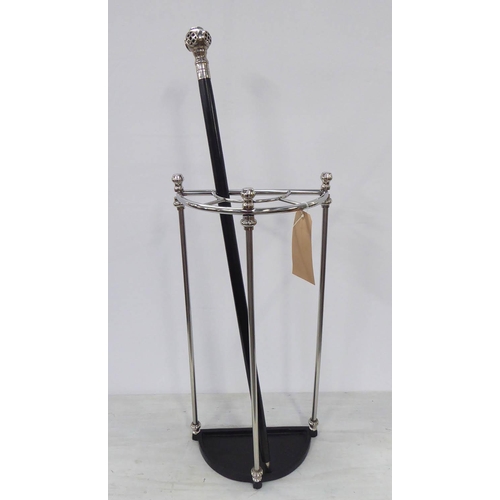 85 - STICK STAND WITH ACCOMPANYING CANE, polished metal, Victorian style, 66cm tall.