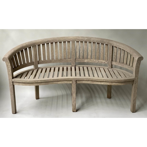 611 - BANANA BENCH, vintage weathered teak and slatted construction, 168cm W.