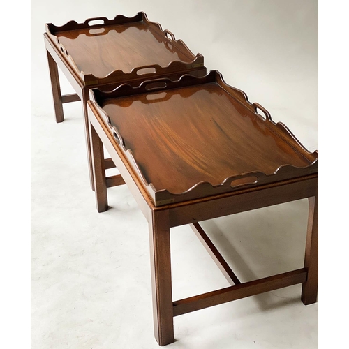 595 - TRAY TABLES, a pair, George III design, mahogany, each rectangular handle pierced, on stands, 76cmn ... 