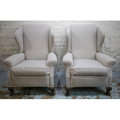 584 - WING ARMCHAIRS, a pair, Georgian style in ticking with cushion seats and hairy paw feet, 99cm H x 81... 