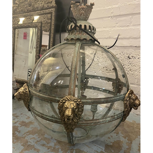 625 - GLOBE HALL LANTERN, 19th century Italian style, verdigris finish with lion head detail, 85cm Drop.