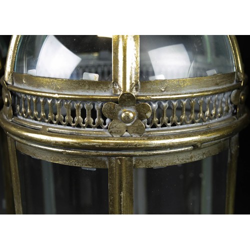 589 - STORM LANTERNS, a set of four, gilt metal and glass, 55cm H. (4)