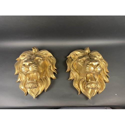 633 - LION HEAD WALL RELIEFS, a pair, gilt finish, 50cm x 40cm approx. (2)