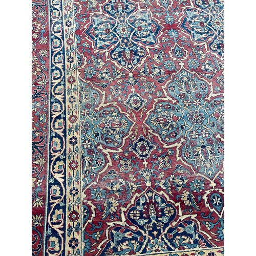 313 - ANTIQUE PERSIAN KIRMAN LAVER CARPET, 375cm x 270cm.