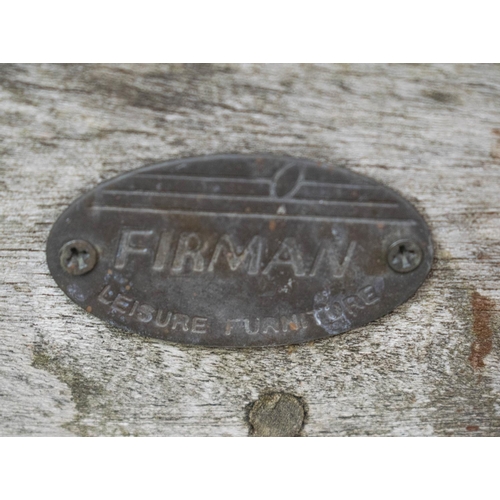 37 - FIRMAN GARDEN BENCH, weathered teak with black and red squab cushion, 140cm W.