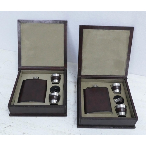 136 - HIP FLASK SETS, a pair, both in tan leathered boxes, 19cm x 19.5cm x 6cm. (2)