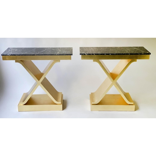 166 - CONSOLE TABLES, a pair, 88cm x 35cm D x 81cm H, bespoke gold leaf decorated X frames with black and ... 