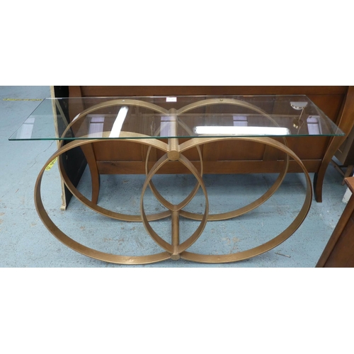 124 - CONSOLE TABLE, 130cm L x 82cm H with a rectangular glass top on a base with entwined circles.