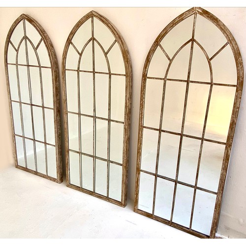 118 - ARCHITECTURAL GARDEN MIRRORS, a set of three, 150cm x 66.5cm, Gothic revival style, aged metal frame... 