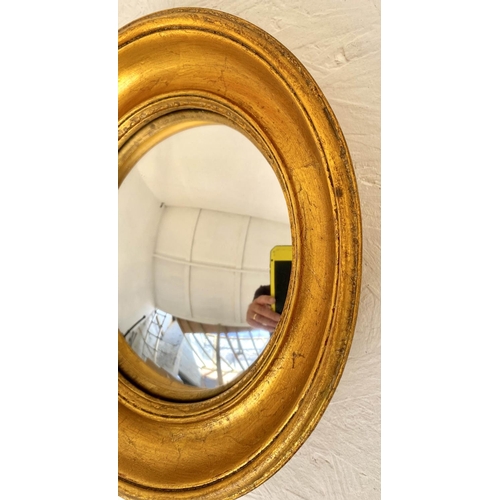 138 - CONVEX WALL MIRRORS, a set of twelve, Regency style, various sizes, gilt finish, 26cm at largest. (1... 